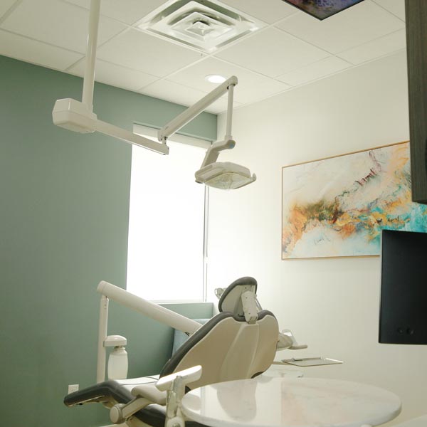Bright dental office with chairs and a reception desk in Dripping Springs, TX